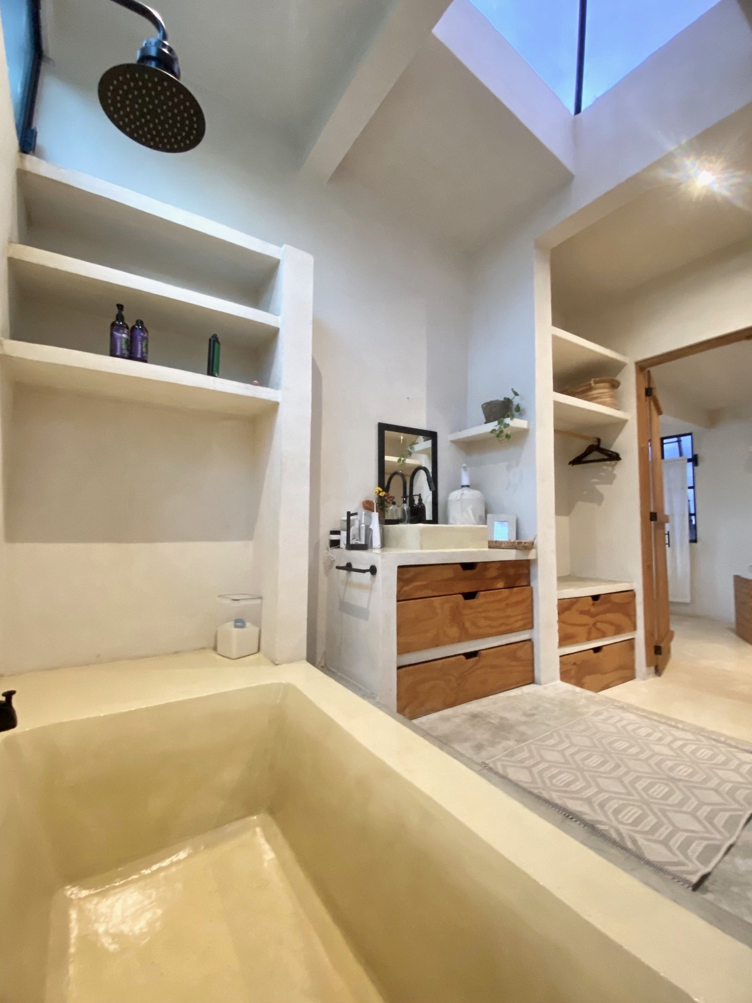 Casa Blanca bathroom with rain shower, built-in tub, vanity and shelving, Rancho Verde Tulum, Tulum, Mexico