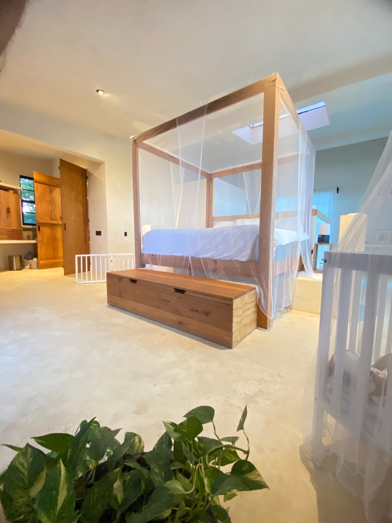 Casa Blanca canopy bed with a wooden storage bench, Rancho Verde Tulum, Tulum, Mexico