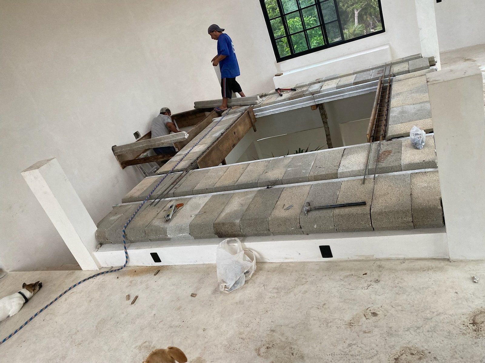 Casa Blanca staircase steps being installed between white plastered walls, Rancho Verde Tulum, Tulum, Mexico