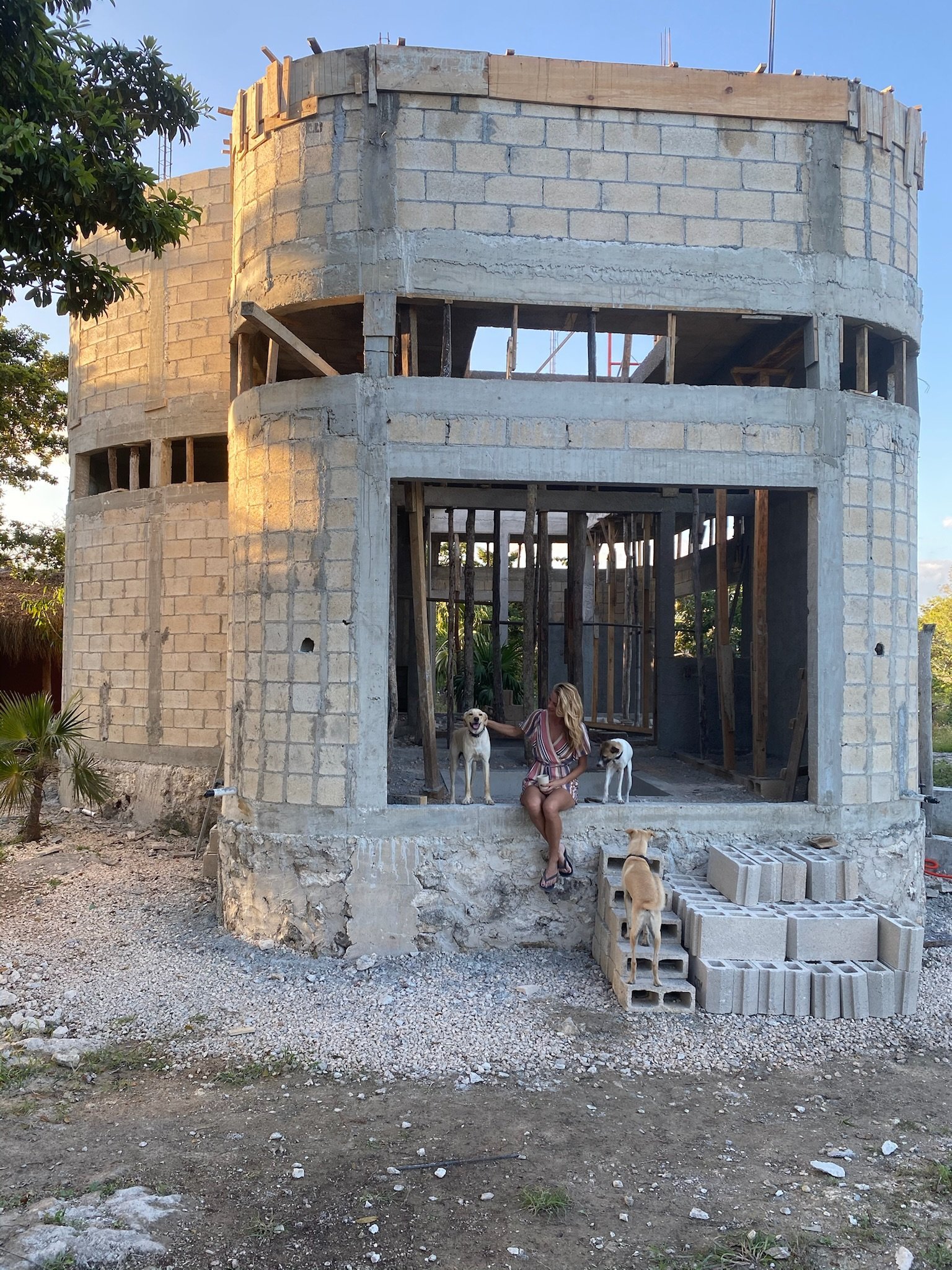 Casa Blanca rough concrete block exterior, with Fem and three dogs, Rancho Verde Tulum, Tulum, Mexico