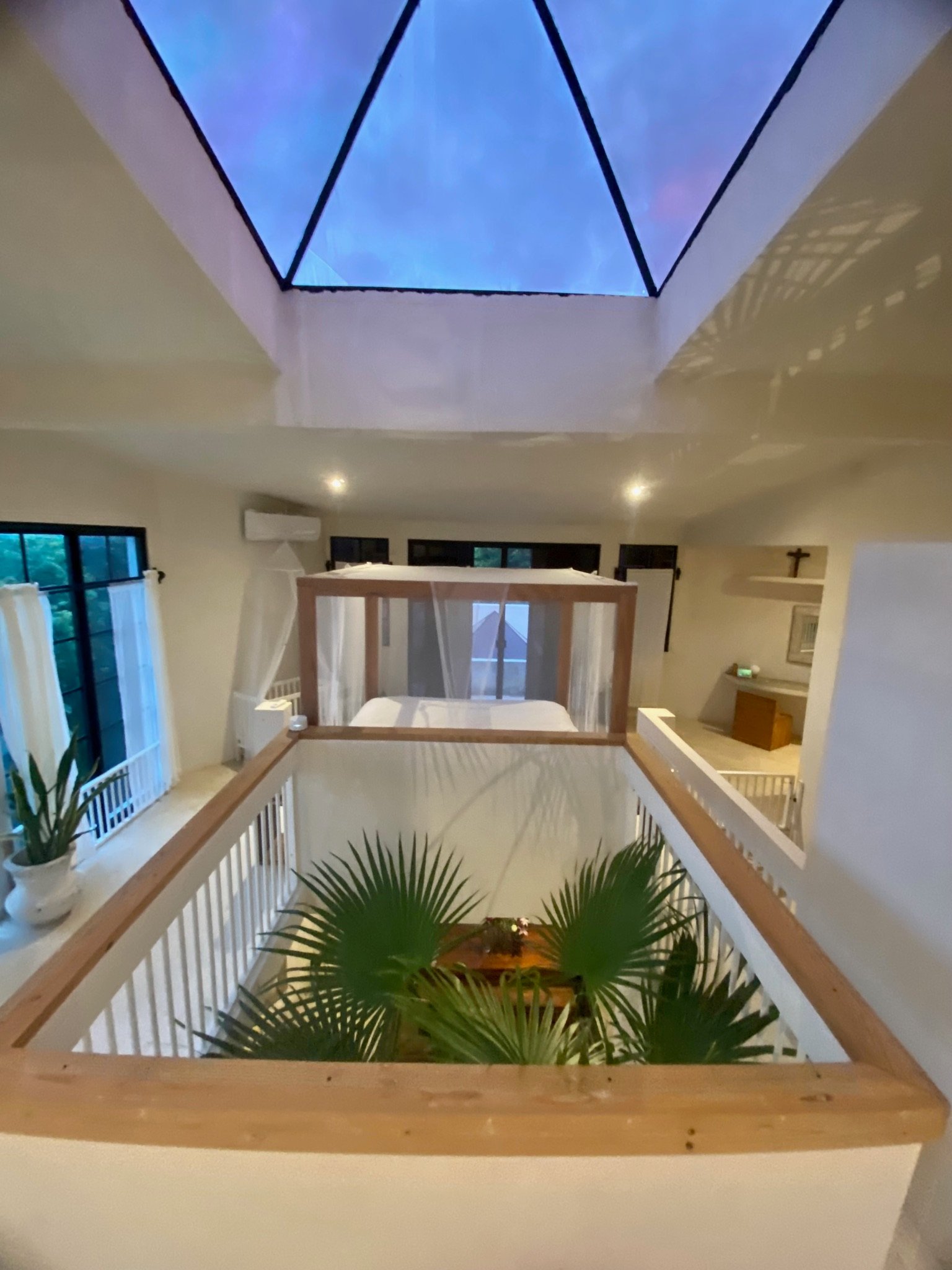 Casa Blanca canopy bed loft under the pyramid roof window, overlooking the courtyard, Rancho Verde Tulum, Tulum, Mexico