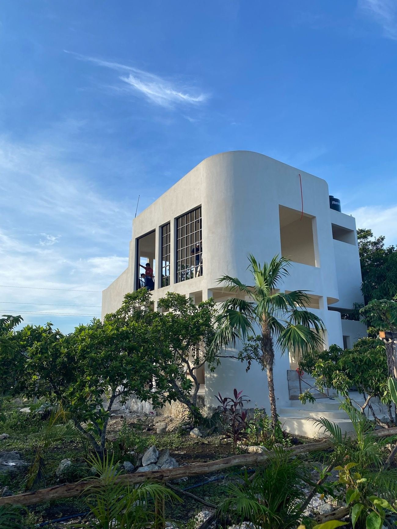 Casa Blanca finished, white exterior with steel-framed windows, Rancho Verde Tulum, Tulum, Mexico