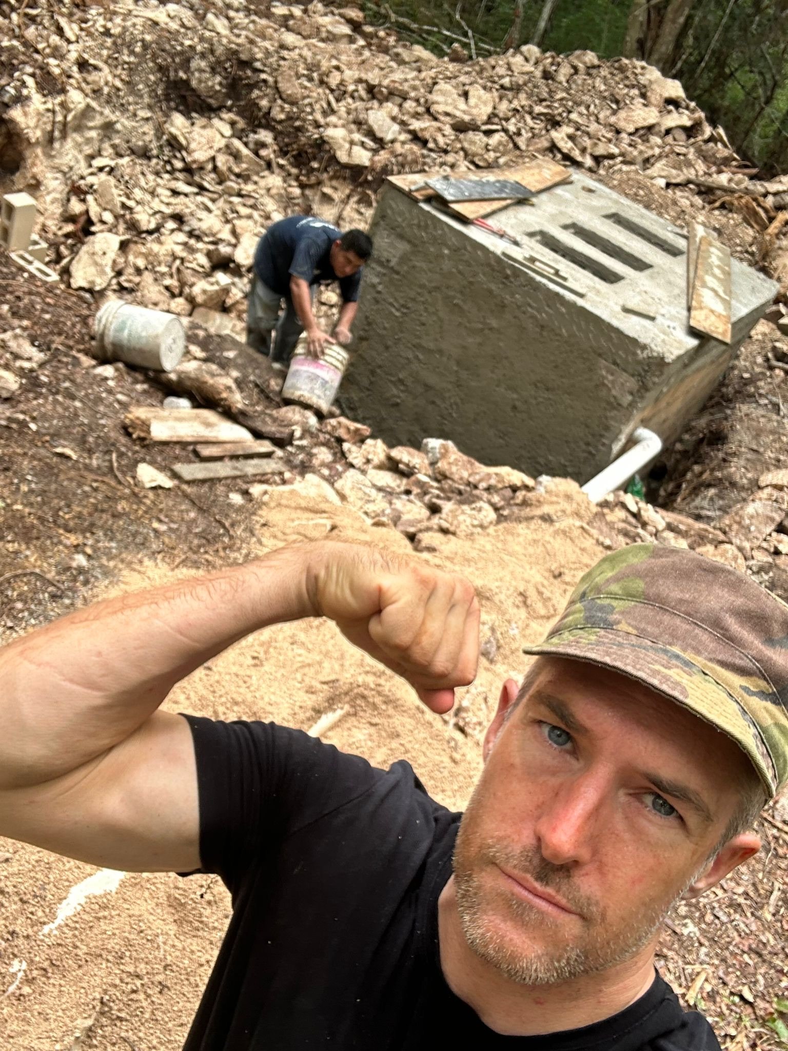 The team working together on a concrete form, Rancho Verde Tulum, Tulum, Mexico
