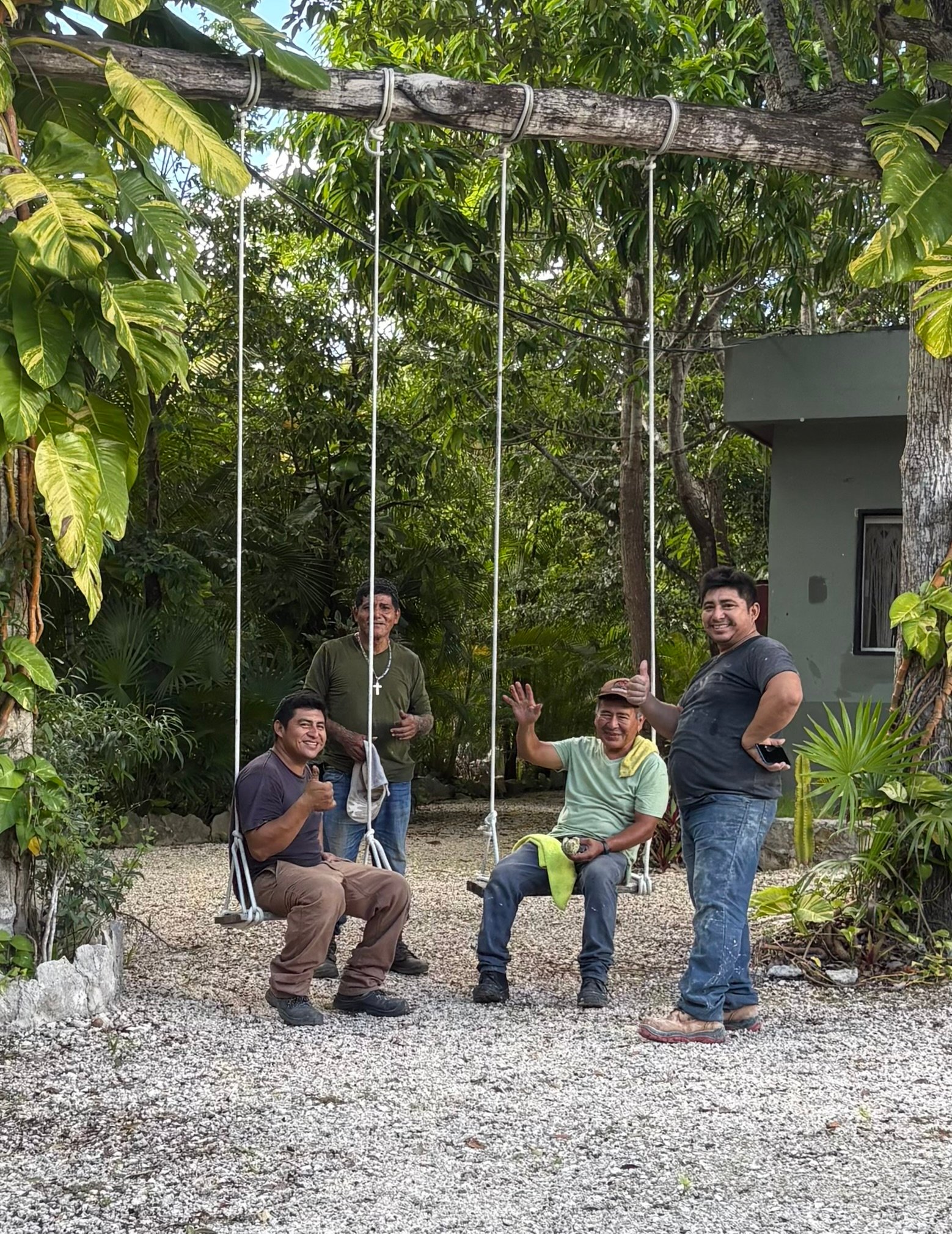 Four of our builders taking a break on the garden swings at Rancho Verde Tulum, Rancho Verde Tulum, Tulum, Mexico
