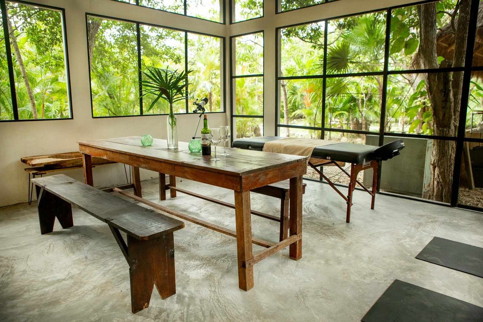 Same room finished with dining table, benches, massage table and yoga mats, Rancho Verde Tulum, Tulum, Mexico