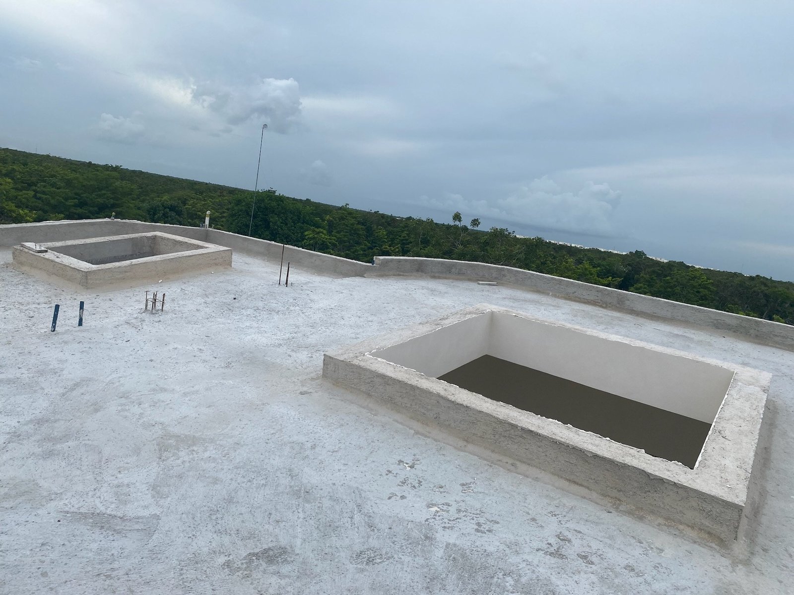 Roof openings in the concrete slab, before the glass pyramids were installed, Rancho Verde Tulum, Tulum, Mexico