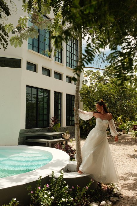 Bride beside the villa plunge pool at Rancho Verde Tulum