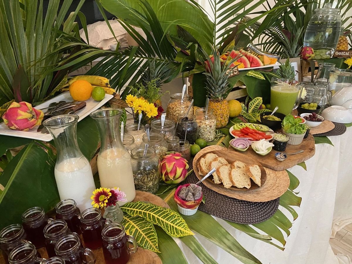 Vegan breakfast buffet with homemade plant milks, granola, bread and dragon fruit by Liefs Tulum
