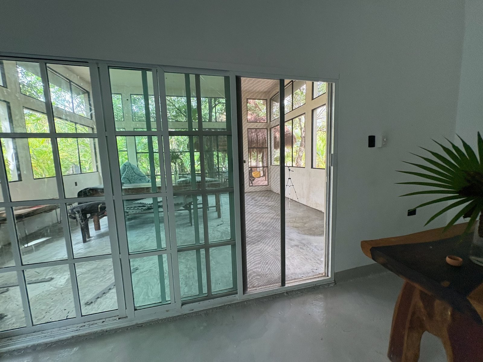 Sliding glass doors into the sunroom, The Family House, Airbnb at Rancho Verde Tulum