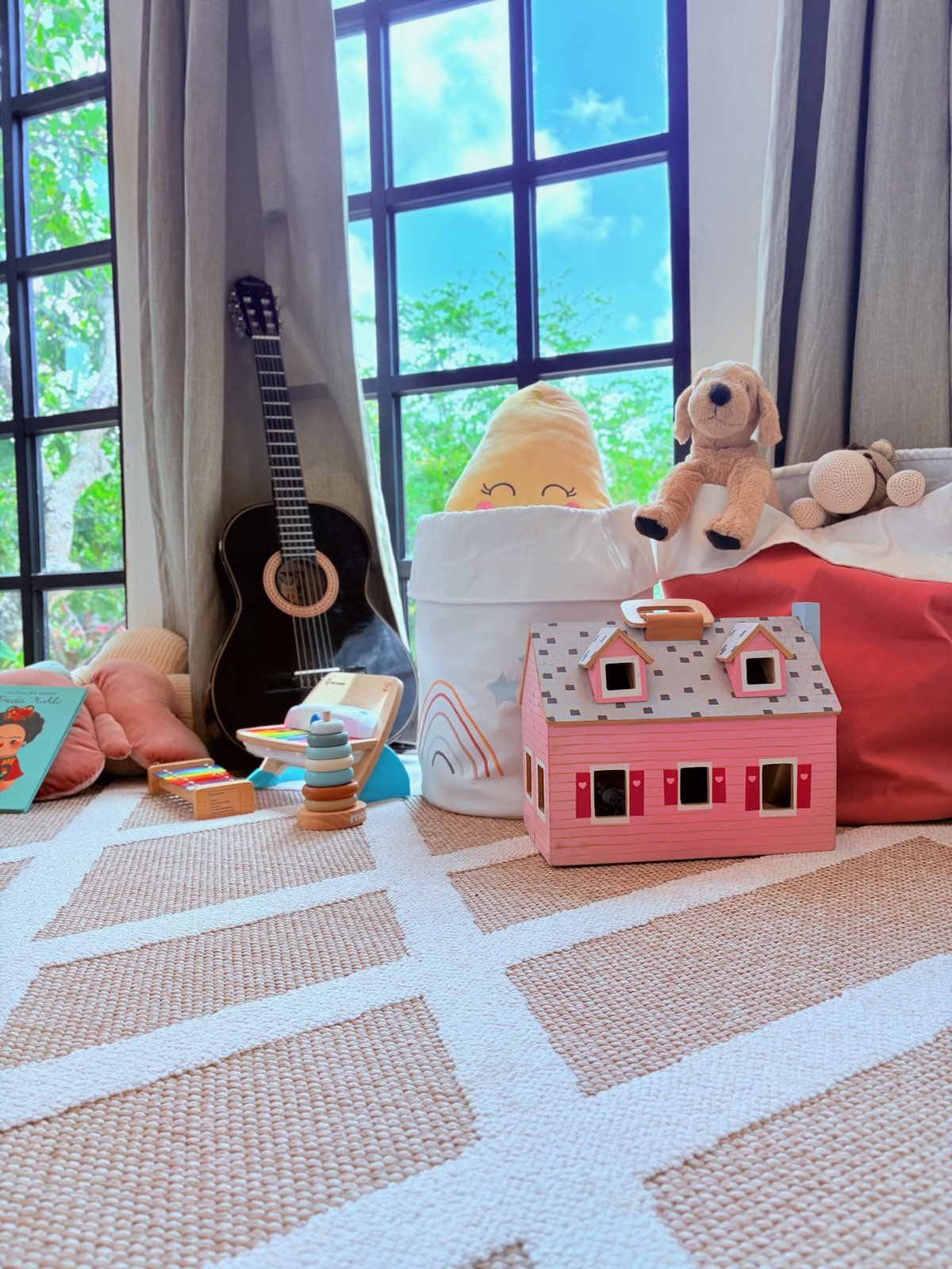 Kids corner with toys and a guitar by the garden window, Airbnb at Rancho Verde Tulum