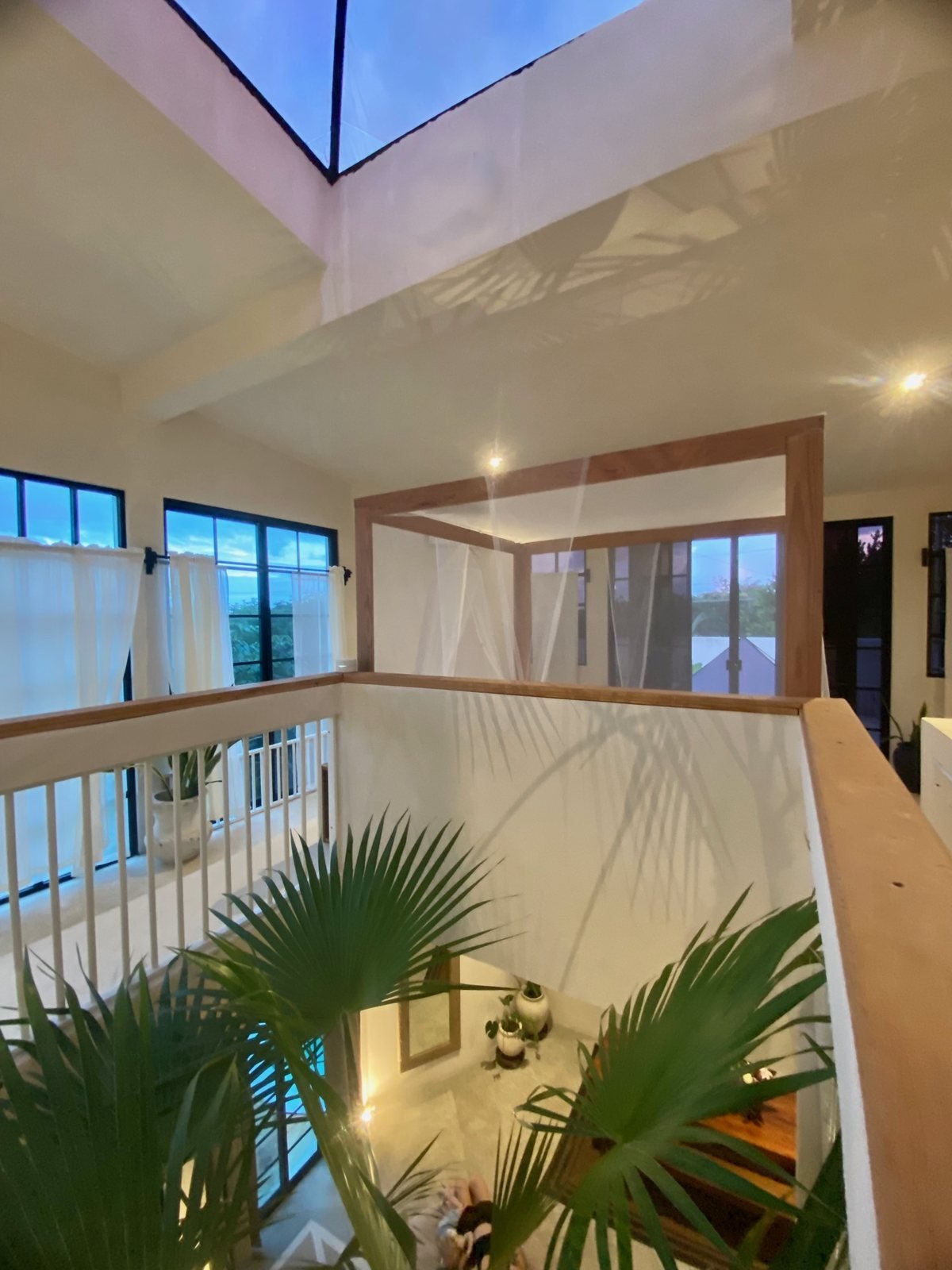 Upstairs loft with pyramid skylight and canopy bed at dusk, The Villa, Airbnb at Rancho Verde Tulum