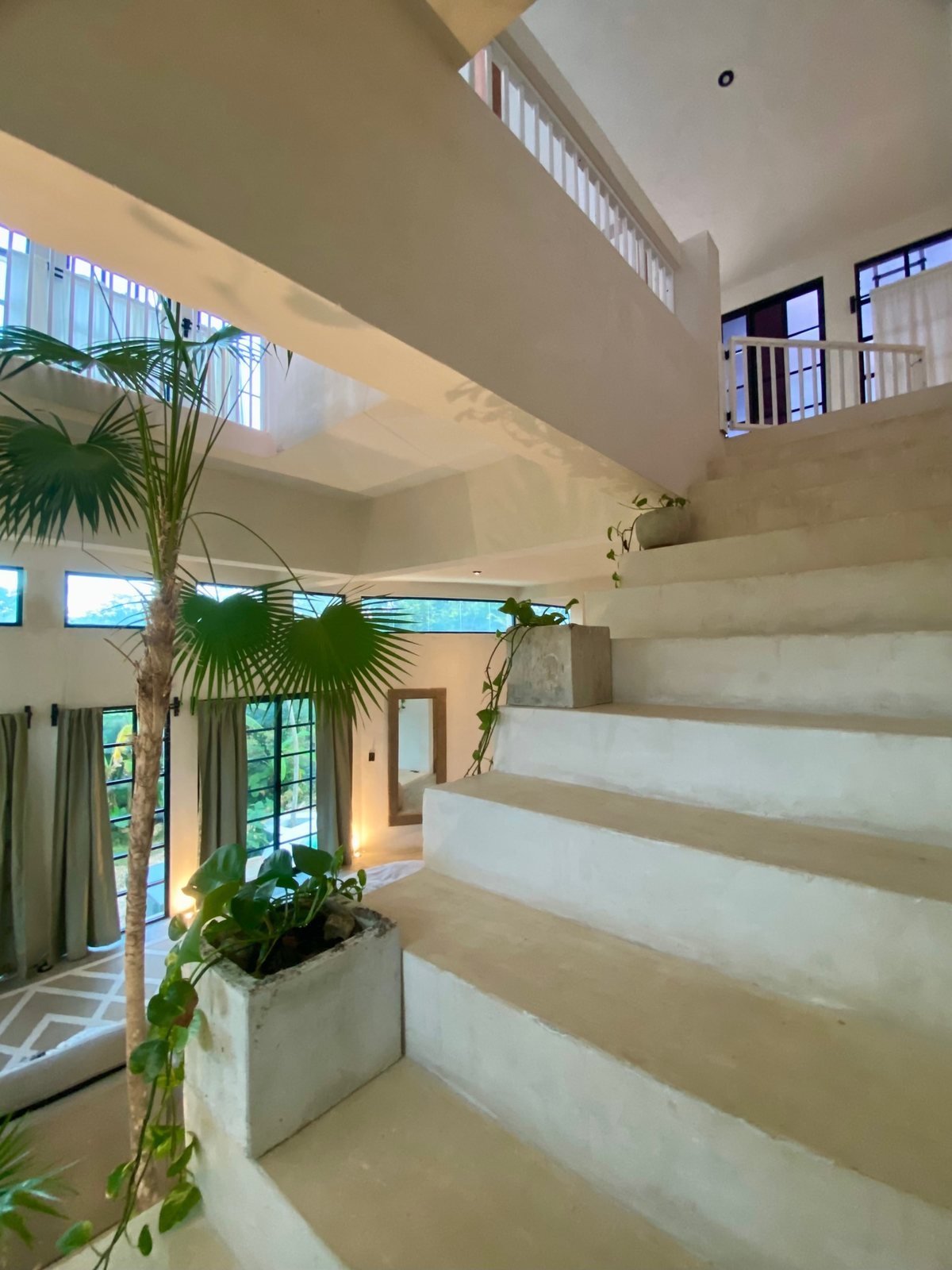 Concrete staircase beside the indoor palm, The Villa, Airbnb at Rancho Verde Tulum