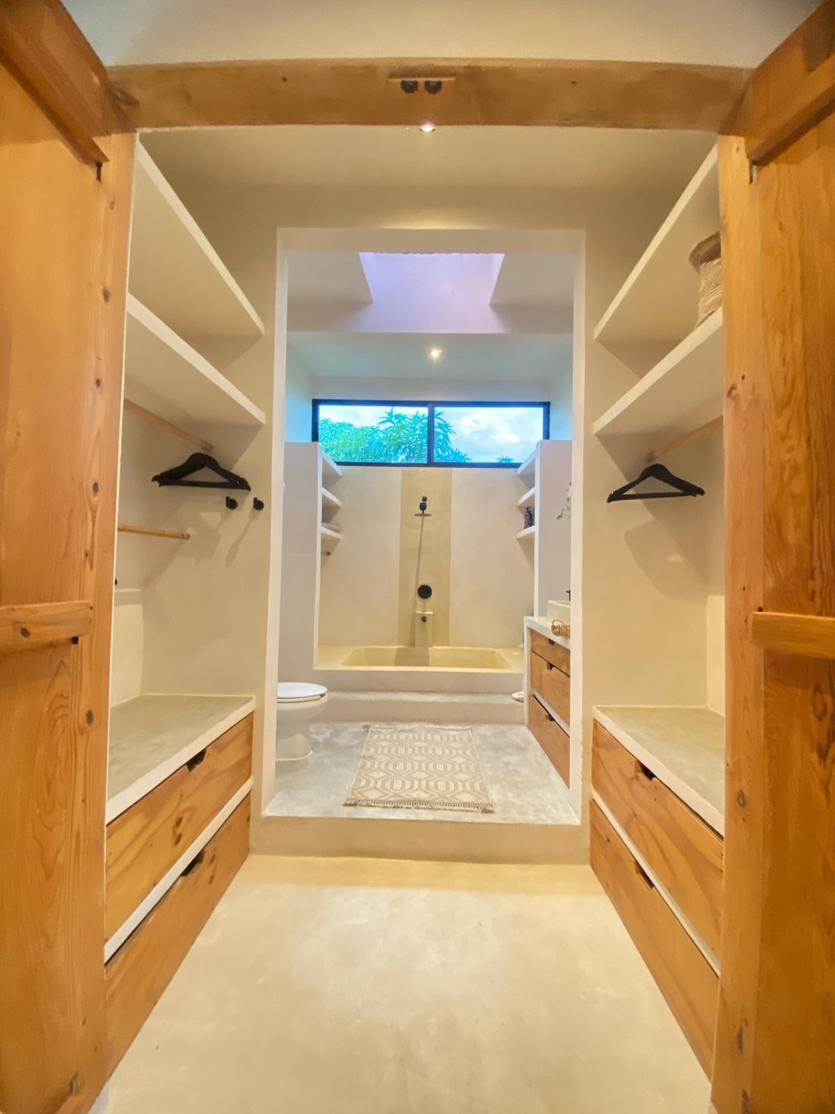 Walk-in closet leading to the bathroom with bathtub and skylight, The Villa, Airbnb at Rancho Verde Tulum