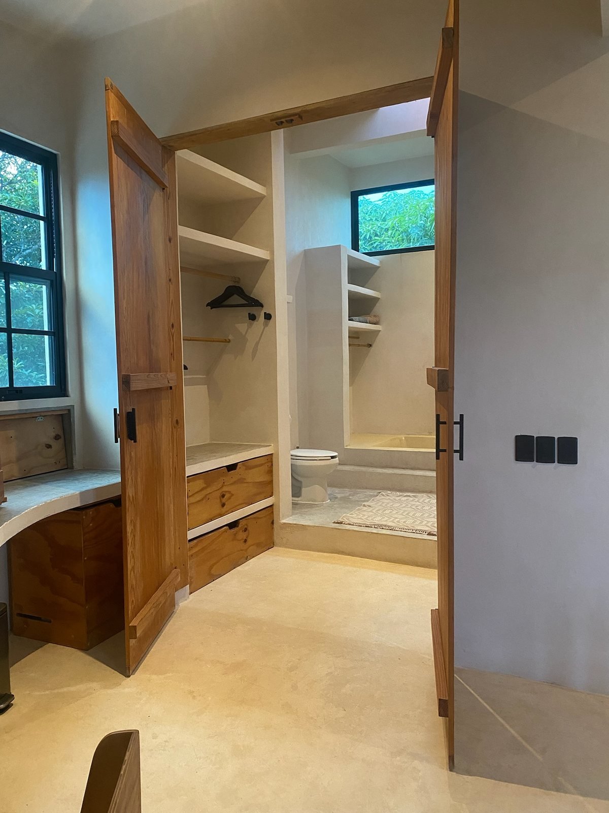 Wooden wardrobe doors opening onto the closet and bathroom, The Villa, Airbnb at Rancho Verde Tulum