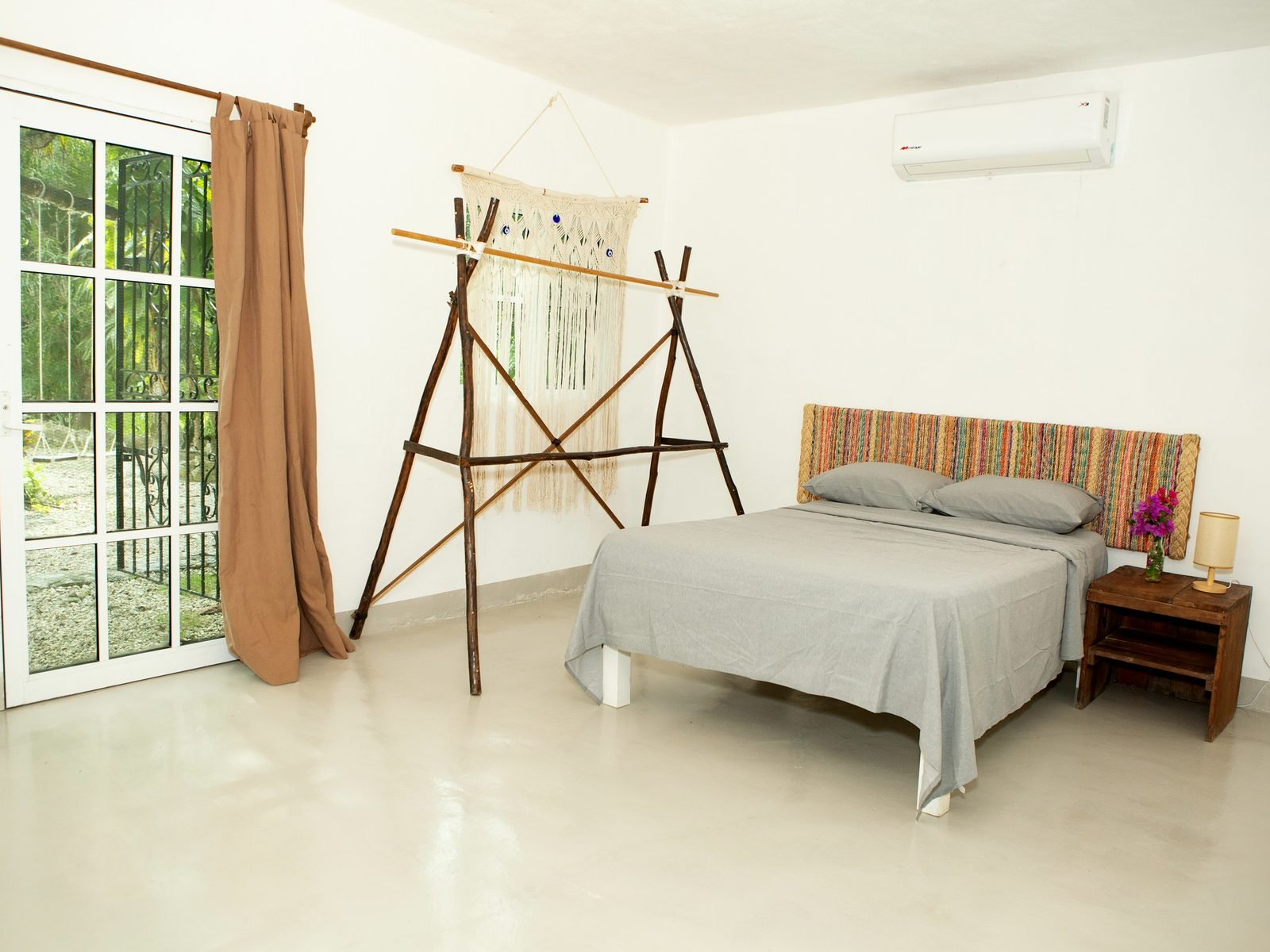 Shared house bedroom with queen bed, air conditioning and a garden door to the jungle, Essence package, Purpose Reset Retreat at Rancho Verde Tulum