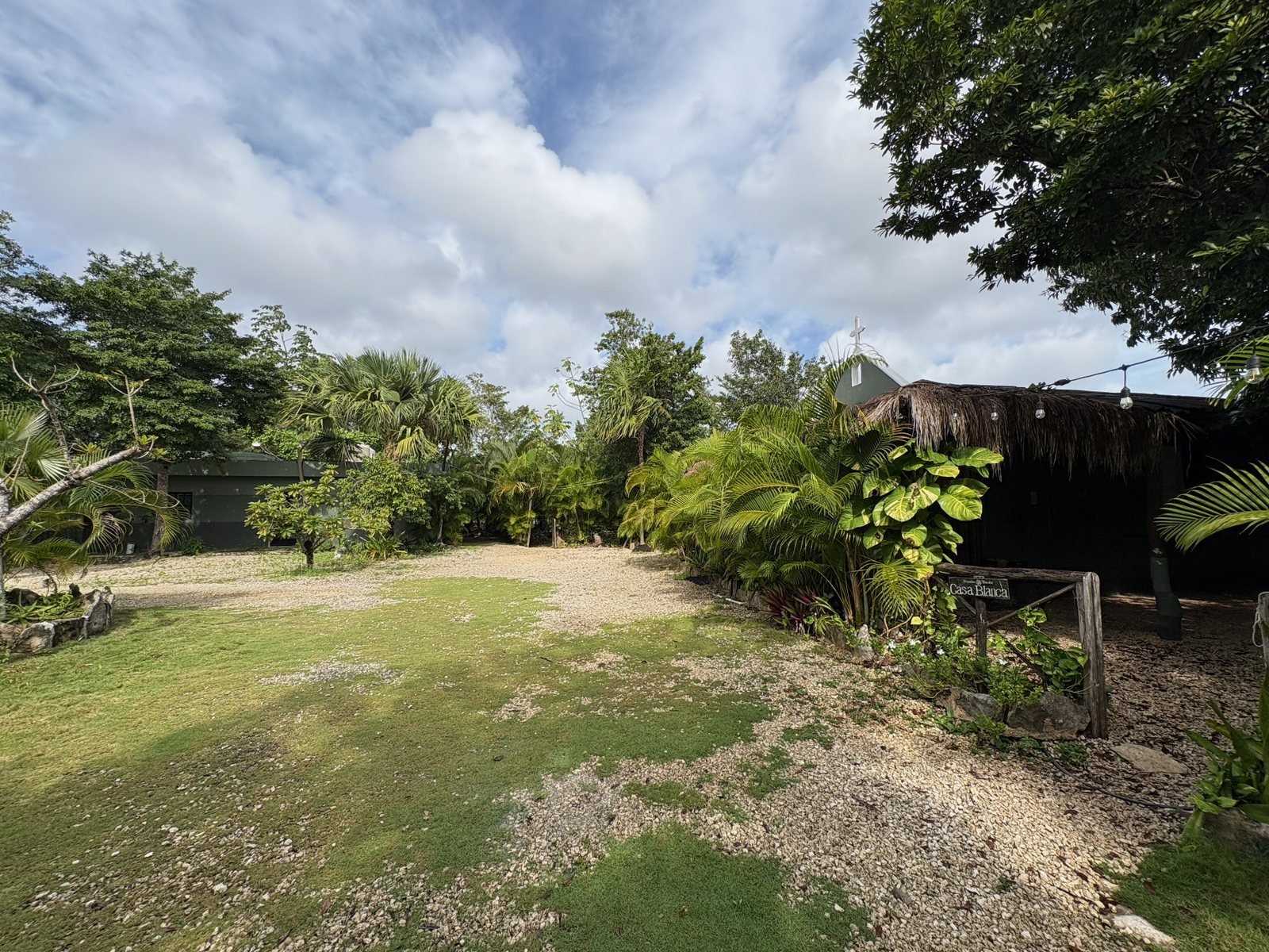 Lawn and gardens beside Casa Blanca and the chapel, Rancho Verde Tulum retreat sanctuary, Tulum Mexico