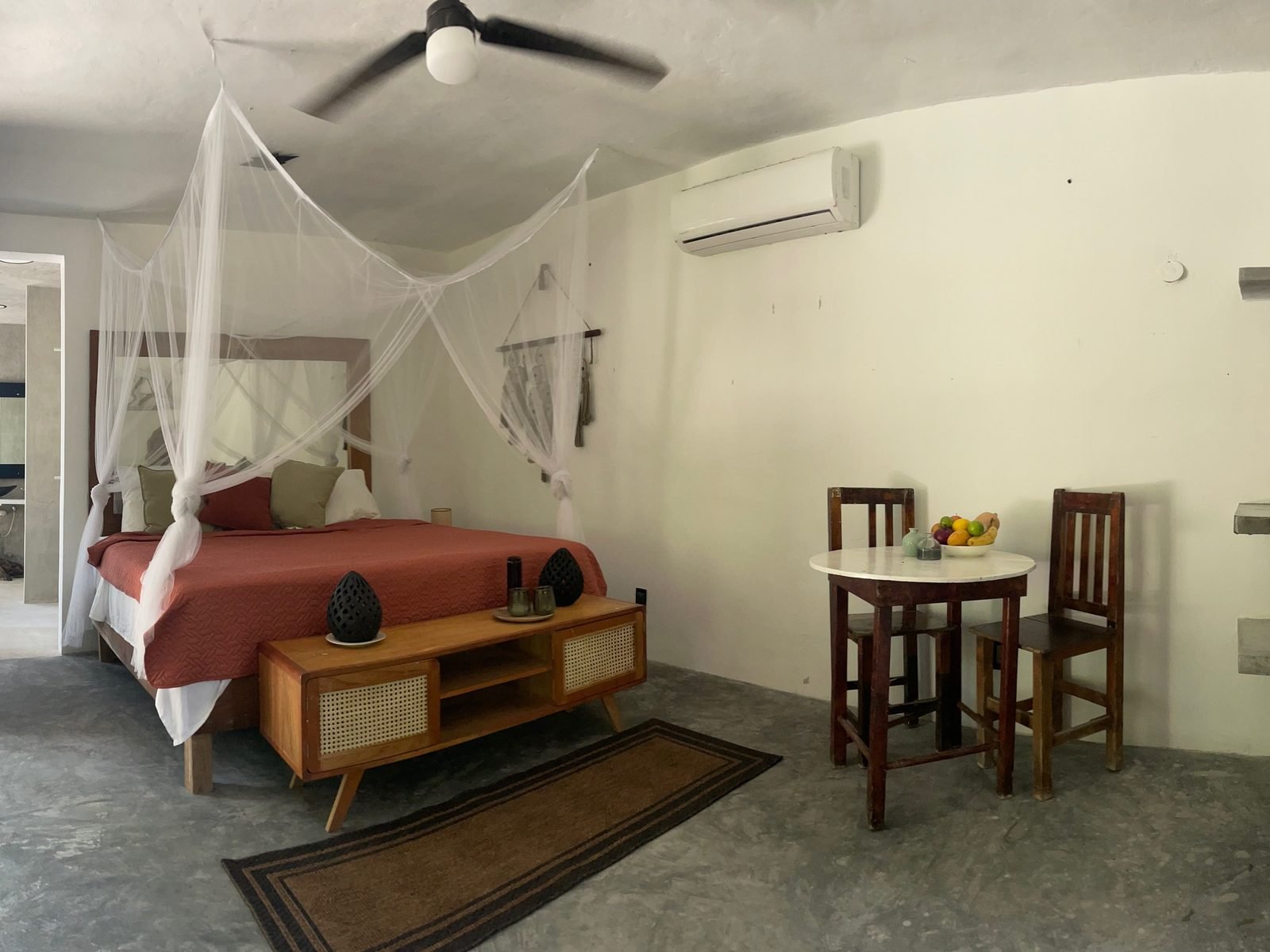 Private studio with canopy bed, terracotta bedding and a marble bistro table, Premium package, Purpose Reset Retreat at Rancho Verde Tulum